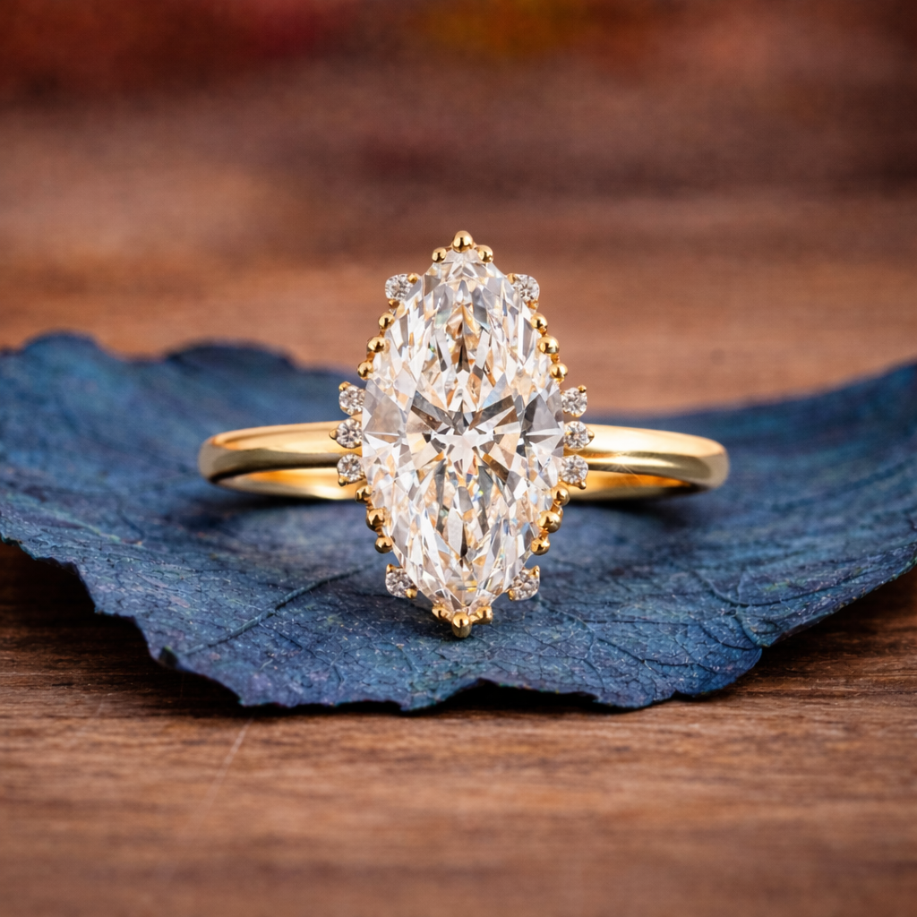 Gold ring with a large diamond on a blue leaf