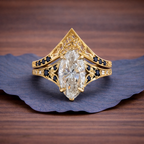 Gold ring with a large diamond on a wooden surface