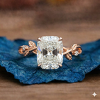 Diamond ring with leaf design on a blue fabric 