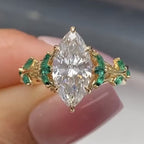 Marquise Cut Moissanite Diamond Floral Engagement Ring with Emerald Accents in Solid Gold Nature Inspired Vintage Design