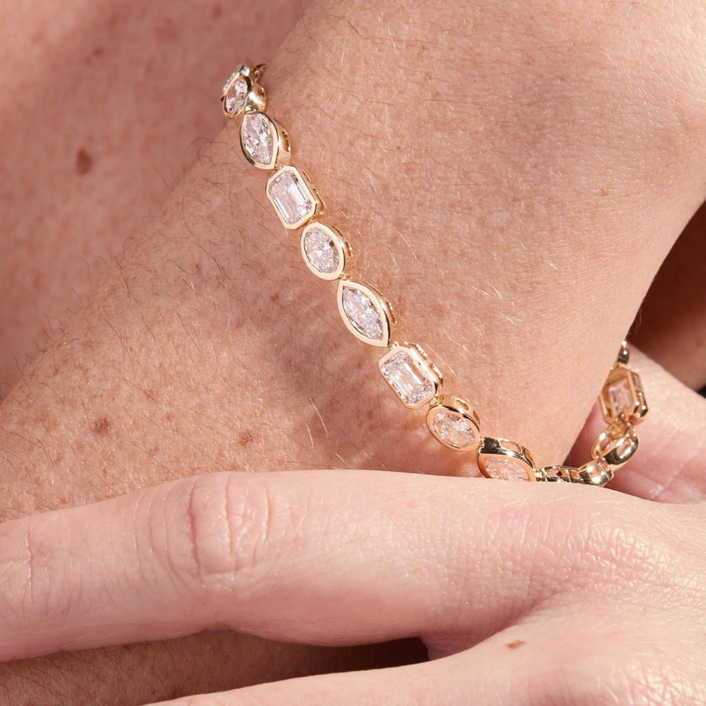 Rose gold bracelet with clear stones on a wrist