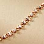 Rose gold bracelet with diamond-like stones on a beige 