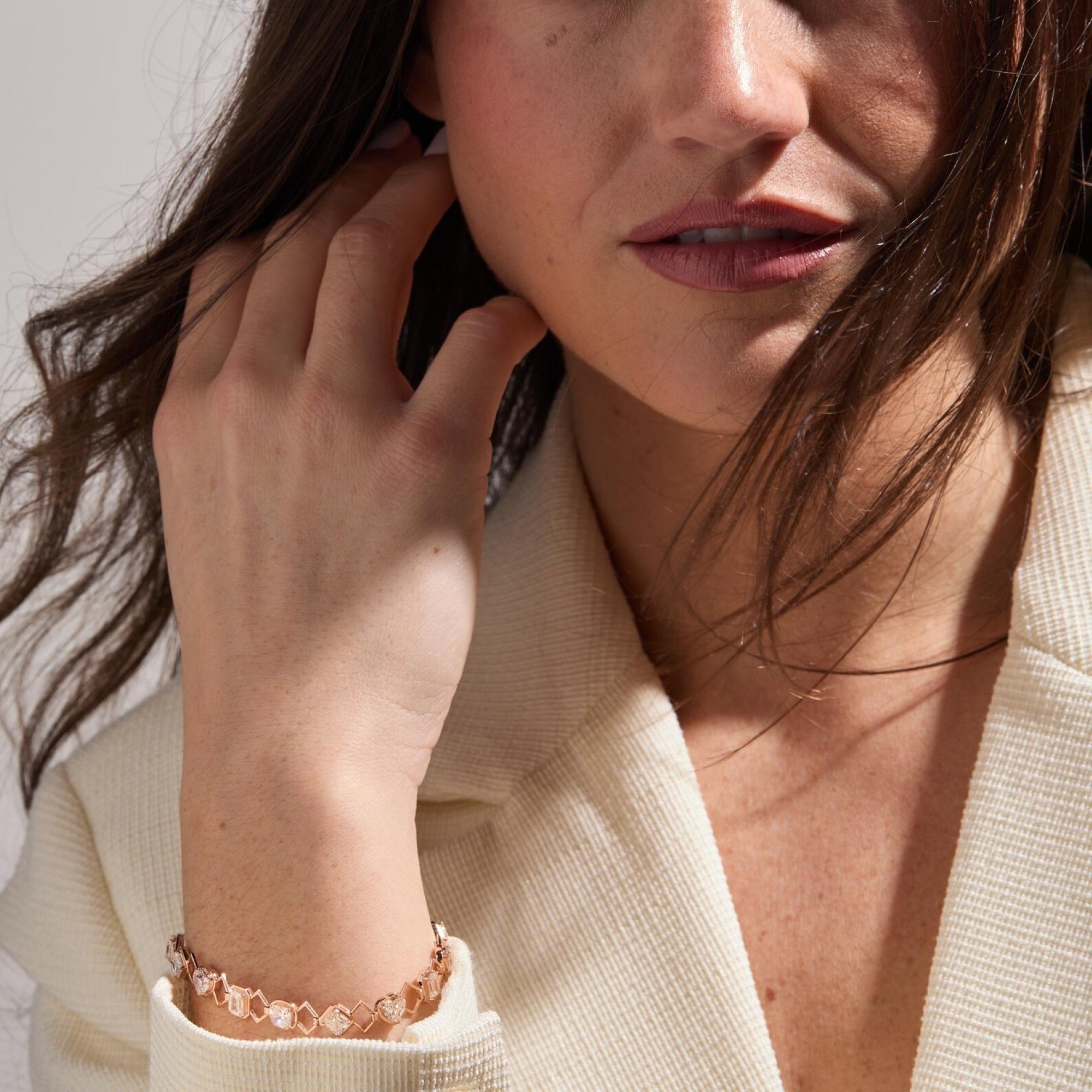 Close-up of a woman wearing a bracelet with a neutral 