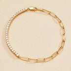 Gold bracelet with clear stones on a beige 