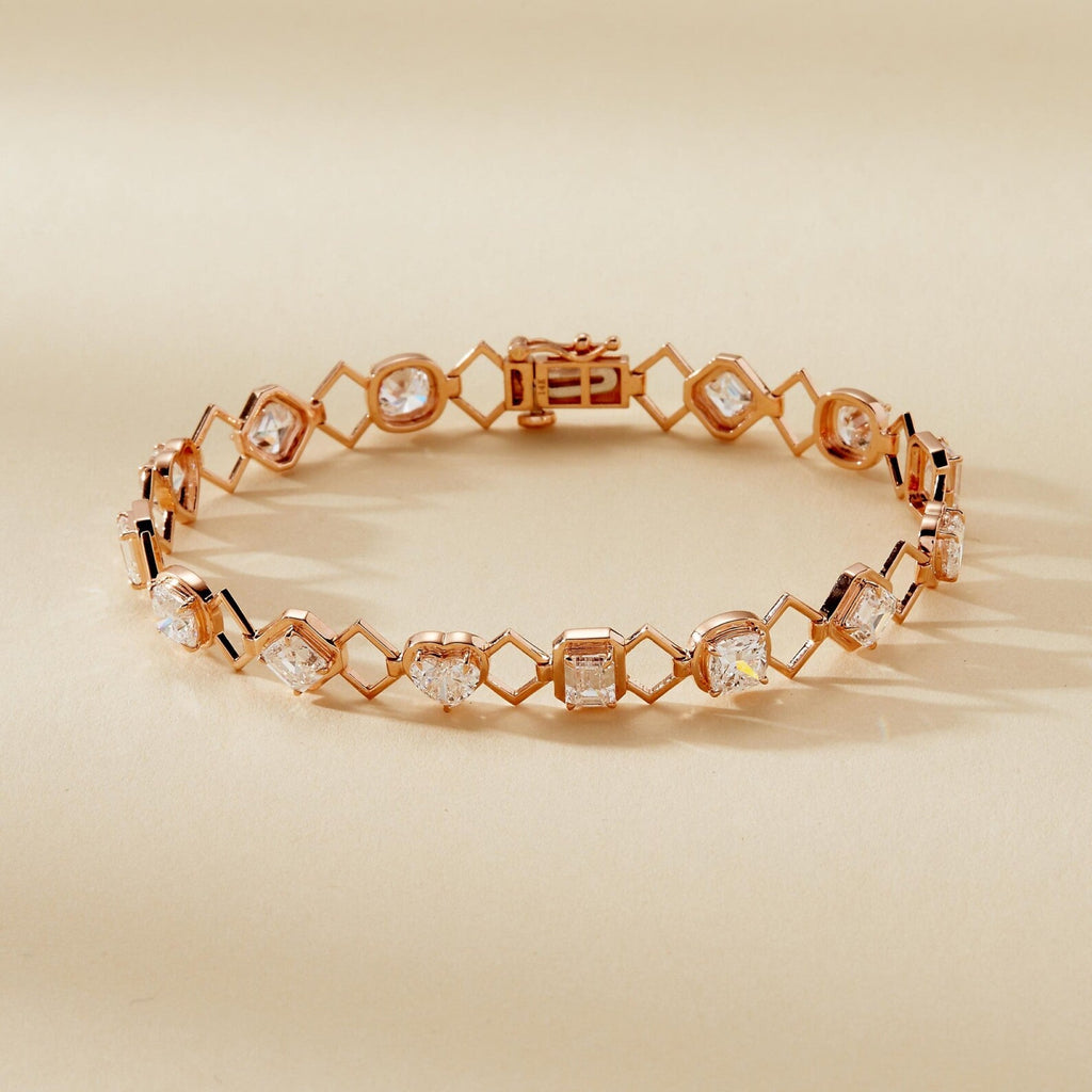 Rose gold bracelet with diamond accents on a beige 